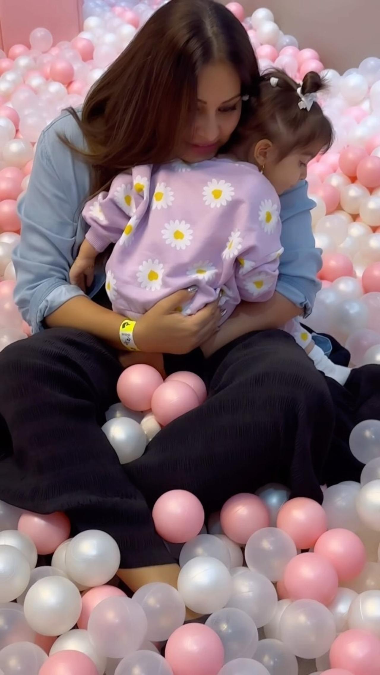 Bipasha embraces a tired Devi in her arms after an exhausting play session. It's as if Bipasha is telling Devi that she will always be there to hold her and make her rest when she's tired and needs a hug.