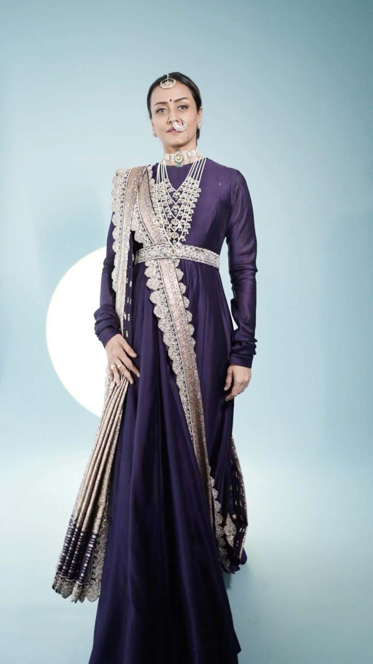 Going all dramatic, Namrata looks regal in this regal purple anarkali set with statement jewellery and a pallu-like draped dupatta.