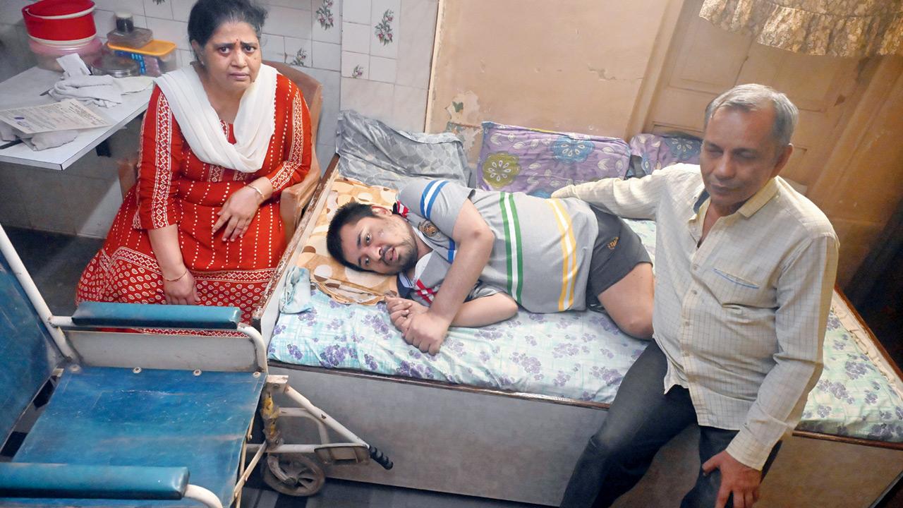 Nayan and Bela Shah with their 36-year-old son Devarth at their home in Girgaum; (below) Nayan and Bela Shah with their son, Devarth Shah, at their Girgaum residence, displaying domicile documents that helped establish his identity. Pics/Sayyed Sameer Abedi