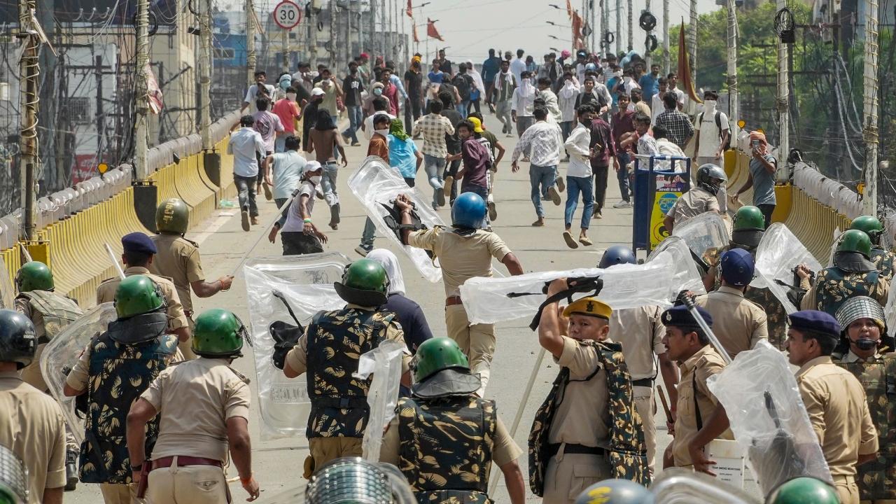 A district administration vehicle is set on fire and several others vandalised as violent protests escalate in Chhapra, Saran district. Police resort to baton charge to control the situation. A district administration vehicle is set on fire and several others vandalised as violent protests escalate in Chhapra, Saran district. Police resort to baton charge to control the situation.