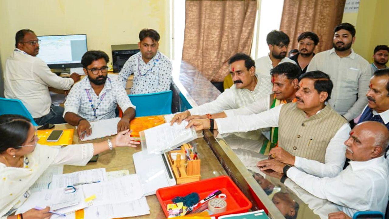 Former Home Minister Narottam Mishra joins BJP candidate Ashutosh Tiwari during nomination filing