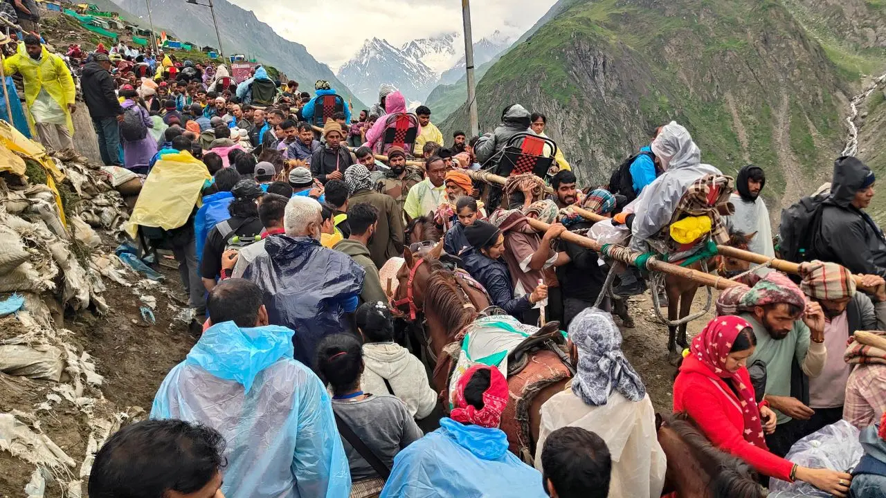 In Photos: Over 8,800 pilgrims leave Jammu for Amarnath Yatra Pilgrims make their way to the holy Amarnath Cave Shrine during the ongoing Amarnath Yatra in Jammu and Kashmir's Ganderbal district. (Pics/ PTI)
