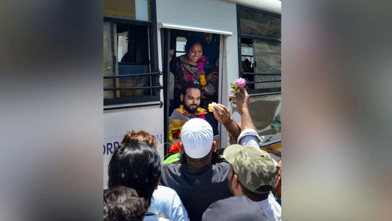 Amarnath Yatra 2026: First pilgrim batch greeted with flower petals in Kashmir Locals welcome the first batch of Amarnath Yatra pilgrims near Banihal Qazigund Road Tunnel, at Qazigund, in Anantnag district, Jammu and Kashmir. Photo courtesy: PTI