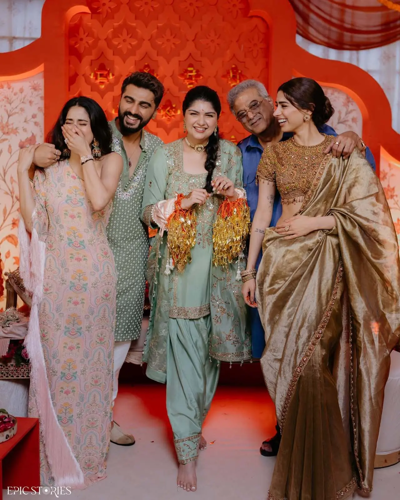 The first family portrait captures a heartwarming moment as Anshula poses with her siblings and dad. Everyone is smiling, while Jahnvi Kapoor goes all giggles, adding a candid touch to the picture