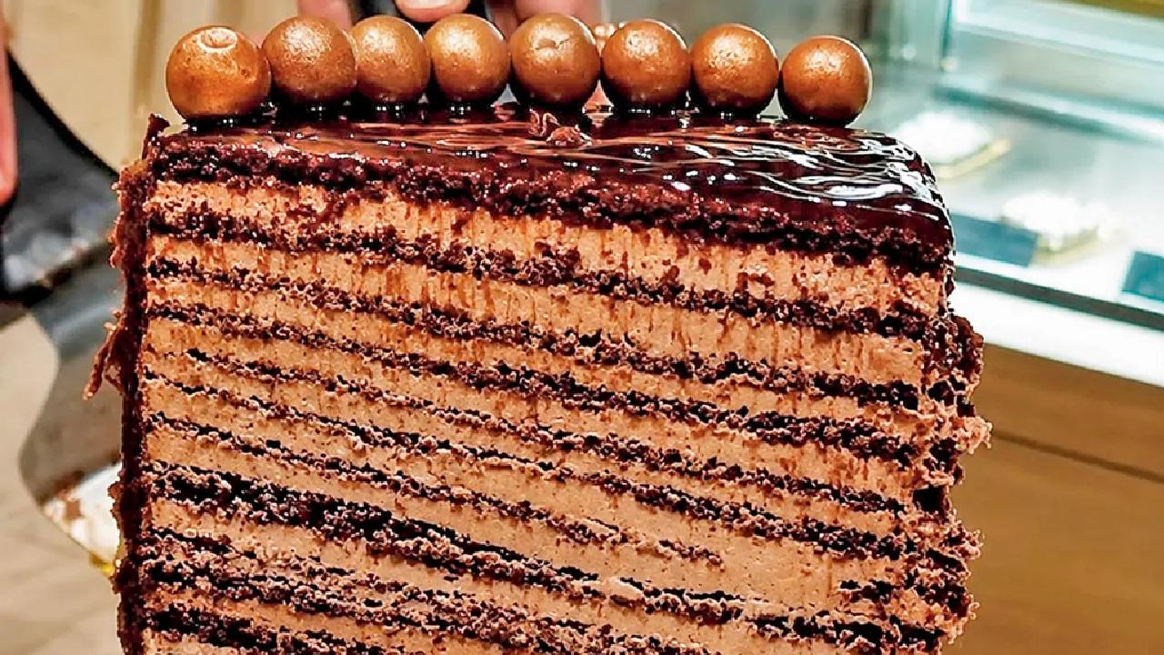 Layered obsession
If the Matilda cake has always been on your bucket list, start here. This towering 48-layer cake, made with Belgian chocolate and deep dark chocolate ganache, is a dessert lover’s dream.(Pic courtesy/The rolling pin)
At The Rolling Pin, Anta Industrial Estate on Senapati Bapat Marg, Lower Parel. Call 46104612Cost Rs 400 Layered obsession
If the Matilda cake has always been on your bucket list, start here. This towering 48-layer cake, made with Belgian chocolate and deep dark chocolate ganache, is a dessert lover’s dream.(Pic courtesy/The rolling pin)
At The Rolling Pin, Anta Industrial Estate on Senapati Bapat Marg, Lower Parel. Call 46104612Cost Rs 400