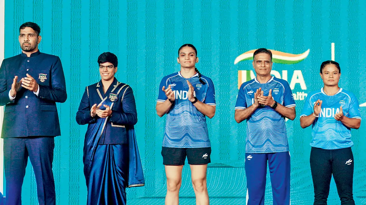 Commonwealth Games: Grand send-off for Indian contingent (From L to R) Boxers Narender Berwal, Parveen Hooda, Arundhati Choudhary with judo coaches Jiwan Sharma and Angom Anita Chanu at the kit unveiling and send-off event for Team India on Tuesday. Pic/PTI