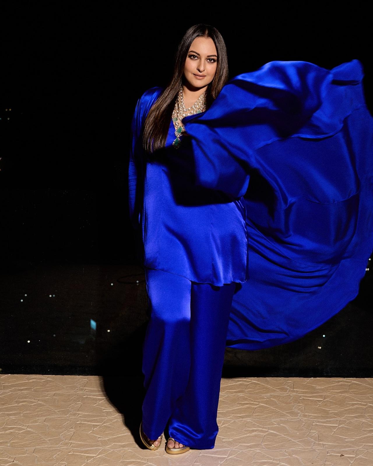 Turning heads in a striking cobalt blue outfit, Sonakshi makes a bold style statement. The dramatic ruffled detailing and layered jewellery elevate the monochrome look. Turning heads in a striking cobalt blue outfit, Sonakshi makes a bold style statement. The dramatic ruffled detailing and layered jewellery elevate the monochrome look.