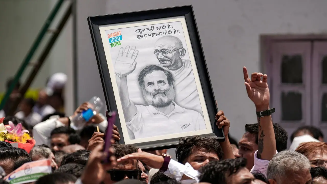 IN PHOTOS: Congress marks Rahul's 56th birthday with nationwide celebrations Congress supporter holds up a portrait of Rahul Gandhi at the AICC headquarters in New Delhi as party workers gather to celebrate Gandhi's birthday. PICS/PTI
