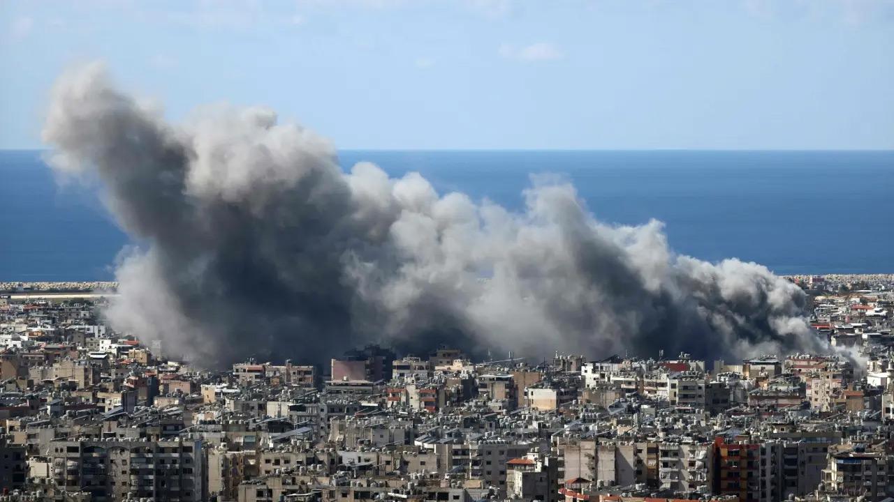 Large plumes of smoke was seen rising following the strikes. Pics/AFP