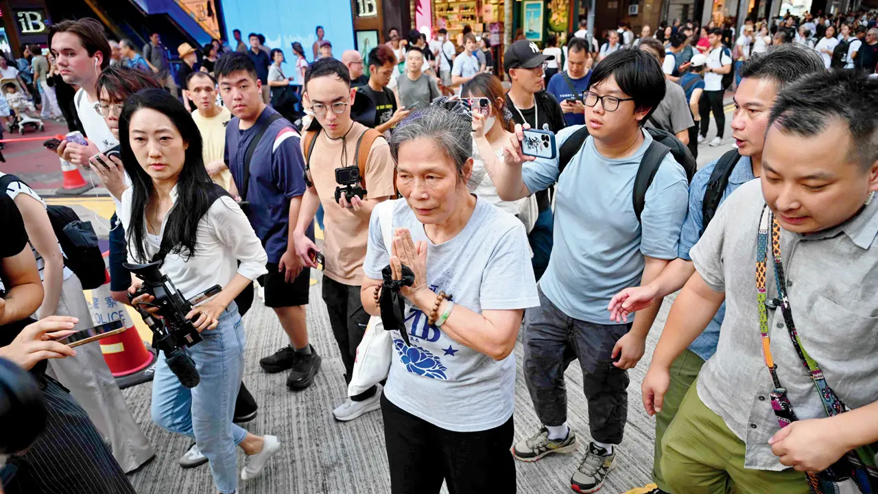 People pay respect to the deceased in Hong Kong. PIC/AFP