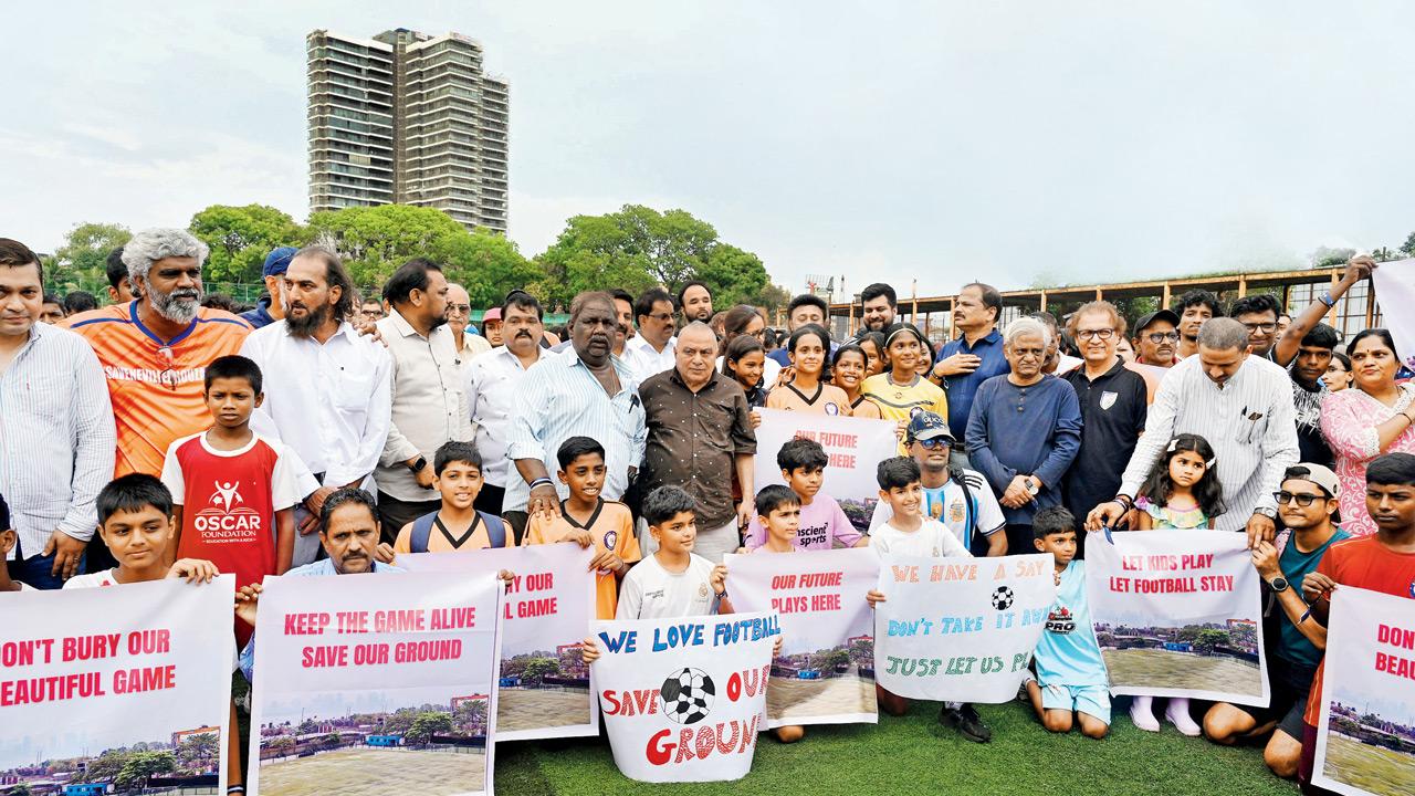 ‘Mr PM, Mr CM, please help us save our ground!’ Members of the Mumbai Football Association and football lovers of all ages stage a protest at the Neville D’Souza ground in Bandra West on Sunday. PICS/ATUL KAMBLE