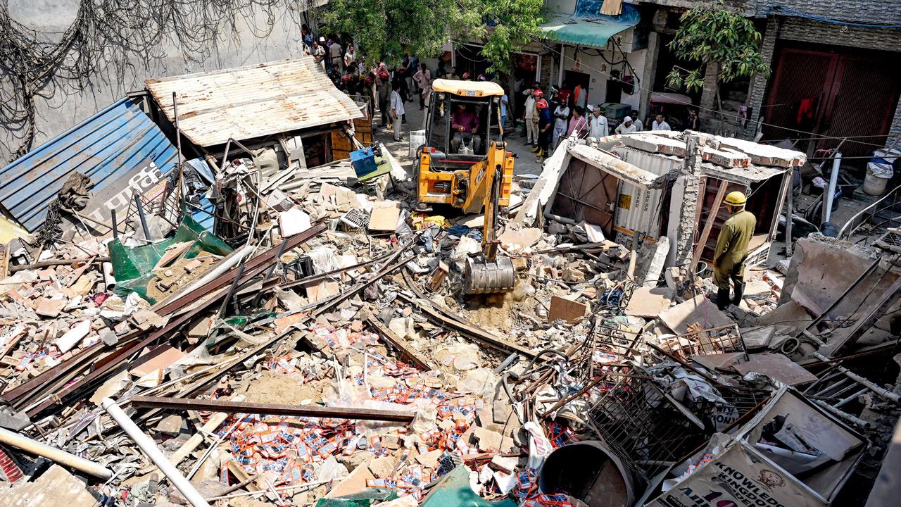 Rescue operation underway at the blast site in north Delhi’s Mukundpur area. PIC/PTI