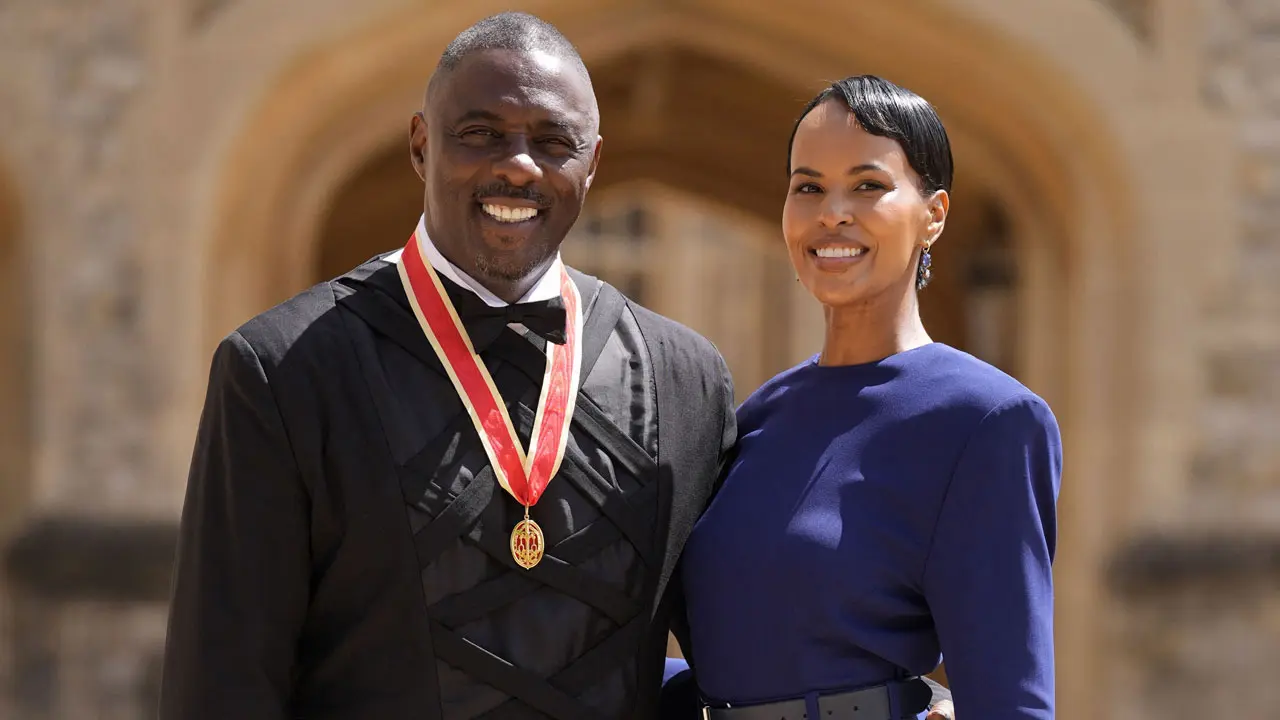 British actor Idris Elba poses with his wife Sabrina Dhowre Elba and his medal after being appointed as a Knight Bachelor (Knighthood) for services to young people at an investiture ceremony at Windsor Castle. Pic/AFP