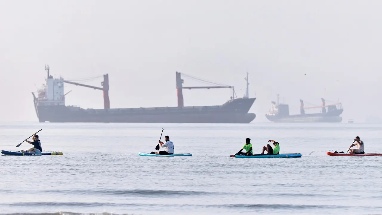 People paddle along the shoreline in the Strait of Hormuz off Bandar Abbas, Iran, on Monday. PIC/AP/PTI