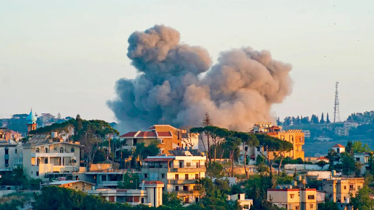 Israel keeps up strikes despite growing momentum for Iran deal Smoke rises from the site of an Israeli airstrike that targeted the southern Lebanese city of Nabatieh on Saturday. PIC/PTI