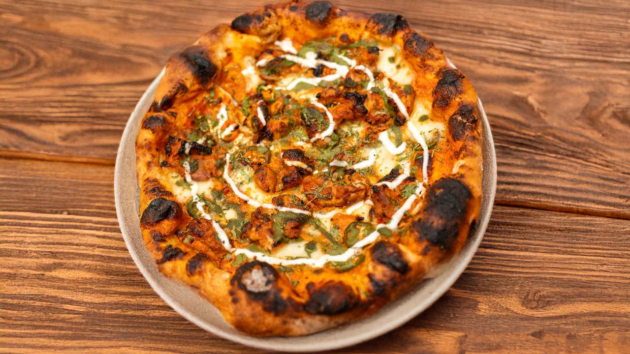 Flavours of Italy&nbsp;Tattva Bar &amp; Cafe has launched a Limited-Edition Neapolitan Menu that features a collection of handcrafted pizzas along with delicious baked items inspired by all the wonderful things about Italian comfort food.&nbsp;
The menu includes dishes such as their Basil Pesto Stracciatella, Bianca pizza, Chicken Tikka pizza, and a Caprese Pesto Panuozza along with a selection of all-time favorites such as Fresh Garlic Bread, Melting Brie Bread, and an irresistible Nutella Pizza to finish things off