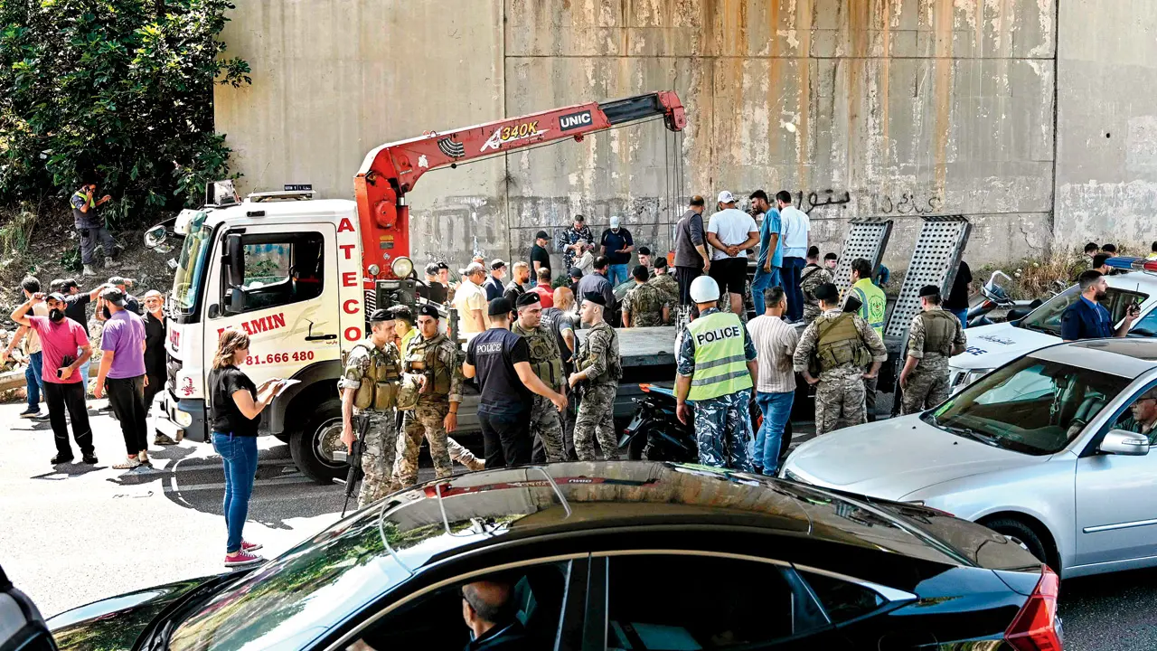 Lebanese security forces at the site of the Israeli drone strike. PIC/AFP