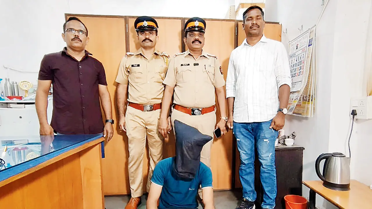 Mohammad Shamsuddin Abdul Matin (sitting) in custody. PIC/BY SPECIAL ARRANGEMENT