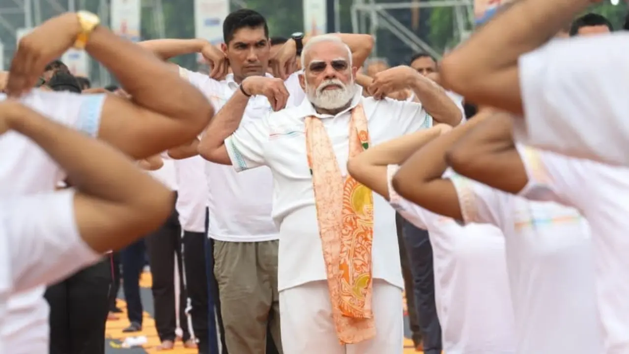 In Photos: PM Modi participates in Yoga Day celebrations at Red Road in Kolkata Pic/X