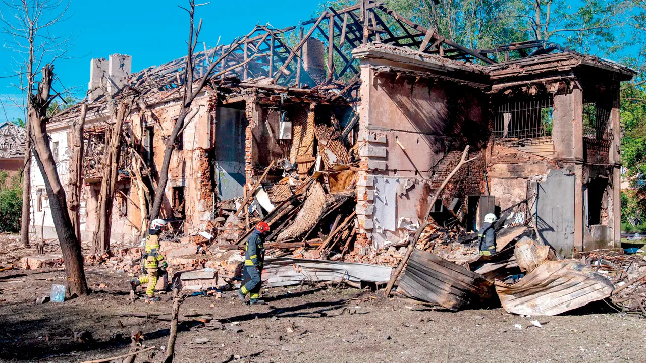 Ukrainian rescuers work at the site of a damaged building following a Russian air attack in Dnipro, on Tuesday. PIC/AFP