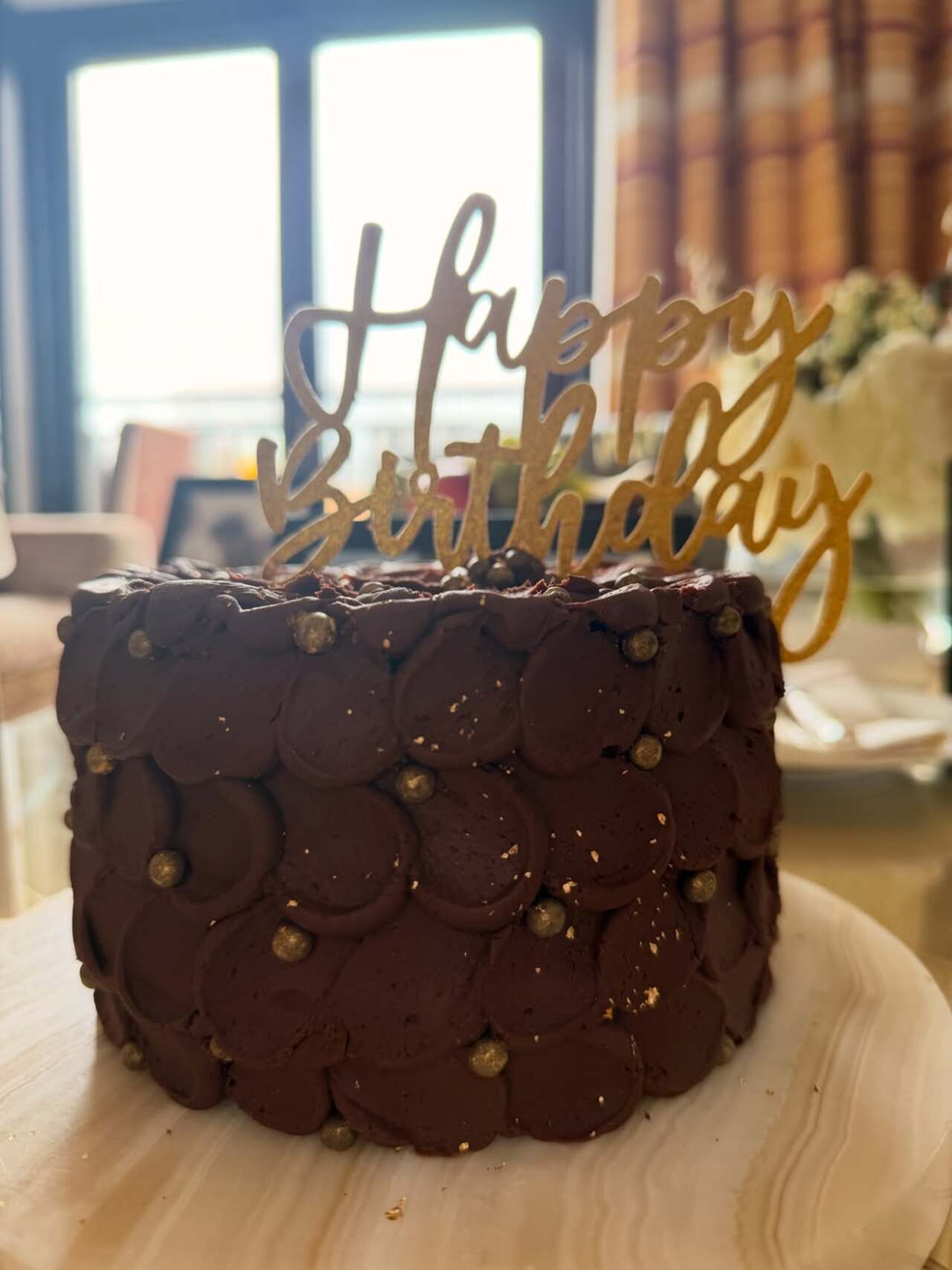 A close-up shot of Sonakshi’s birthday cake offered a sweet glimpse into the celebrations. The decadent chocolate cake, topped with a golden “Happy Birthday” topper. A close-up shot of Sonakshi’s birthday cake offered a sweet glimpse into the celebrations. The decadent chocolate cake, topped with a golden “Happy Birthday” topper.