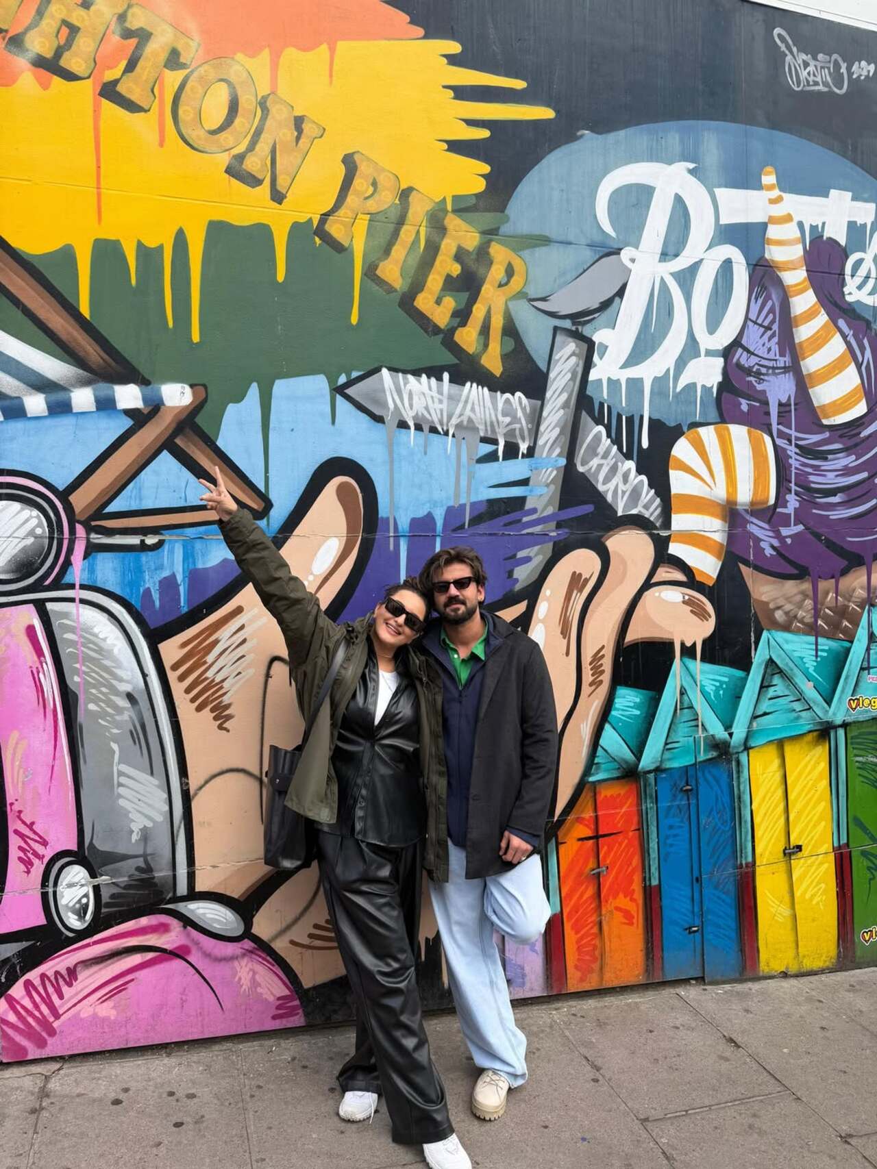 Adding a splash of colour to the album, Sonakshi and Zaheer posed in front of a vibrant graffiti wall. Adding a splash of colour to the album, Sonakshi and Zaheer posed in front of a vibrant graffiti wall.