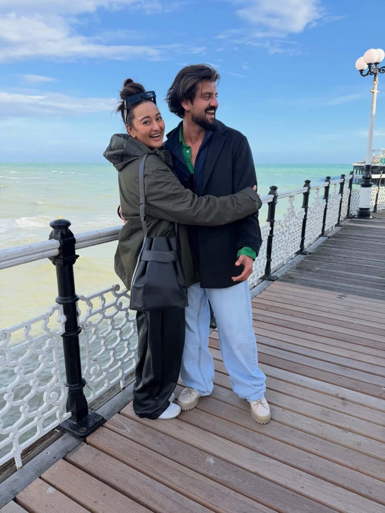 Sonakshi wrapped her arms around Zaheer as the couple shared a laugh while gazing at each other. Sonakshi wrapped her arms around Zaheer as the couple shared a laugh while gazing at each other.