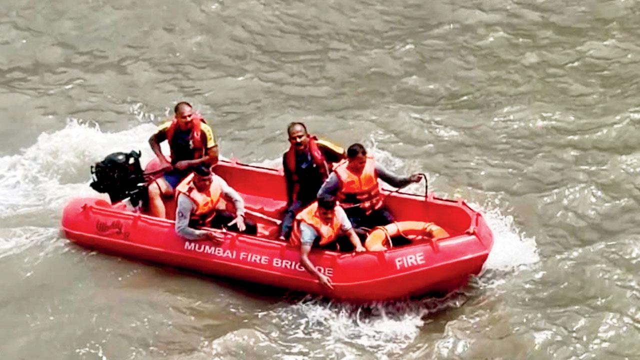 Firefighters carry out the rescue operation below the Bandra-Worli Sea Link on Friday afternoon. PIC/by special arrangement