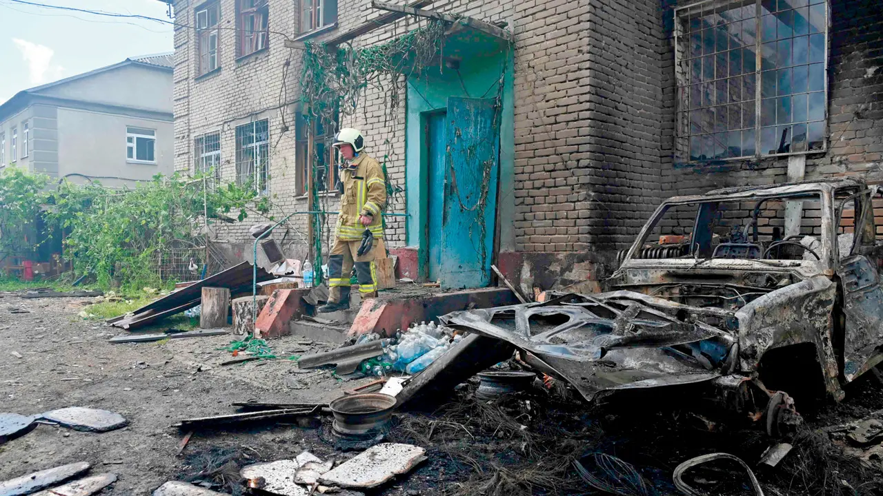 Ukraine strikes bridges in Russian-controlled Kherson as fighting intensifies A Ukrainian rescuer at a building damaged by a Russian attack in Kharkiv, on Wednesday. PIC/AFP