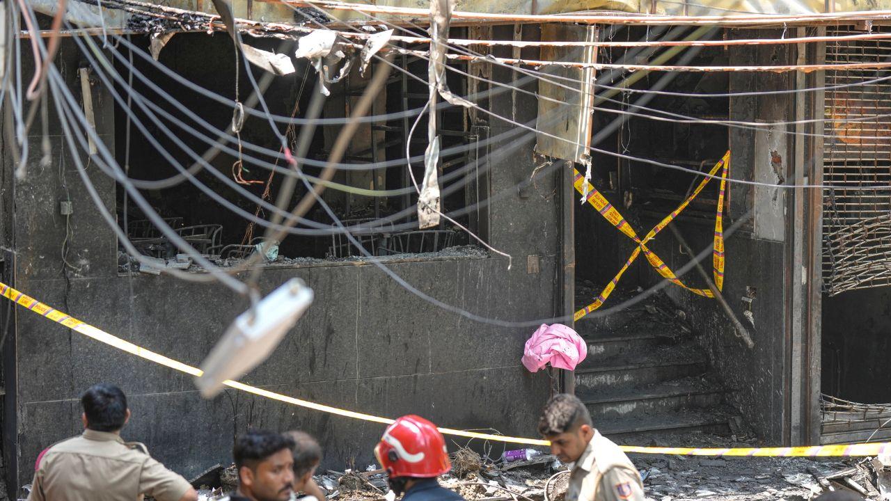Mother jumps with child in her arms to escape deadly delhi hotel fire; 20 killed