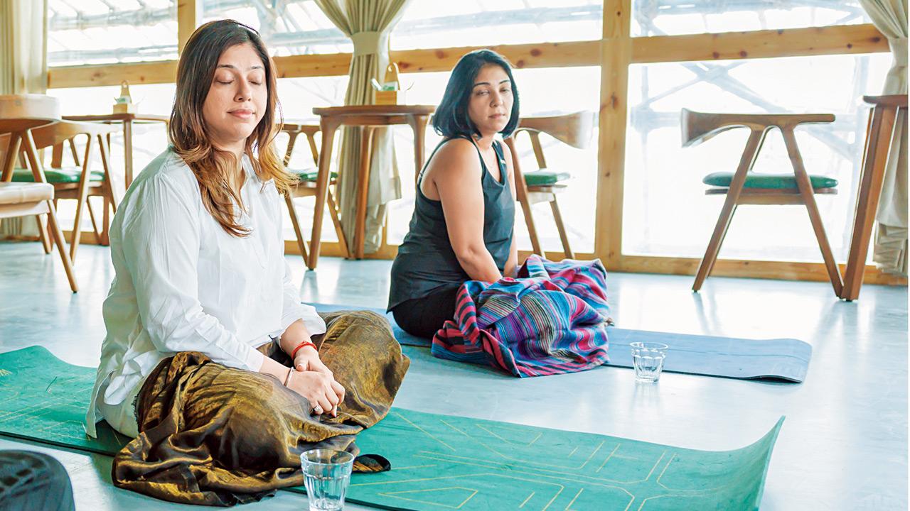 Actors Shruti Seth and Aditi Malik reconnect ahead of International Yoga Day Attendees engage in meditation during a previous Yoga gathering. Pics courtesy/@rumbabaa