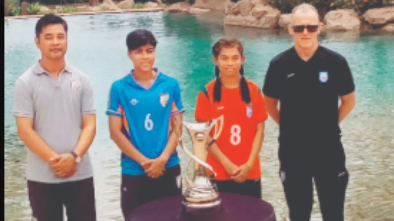(From left to right) India head coach Crispin Chhettri, captain Sangita Basfore, Bangladesh skipper Maria Manda and head coach Peter Butler with the SAFF Cup