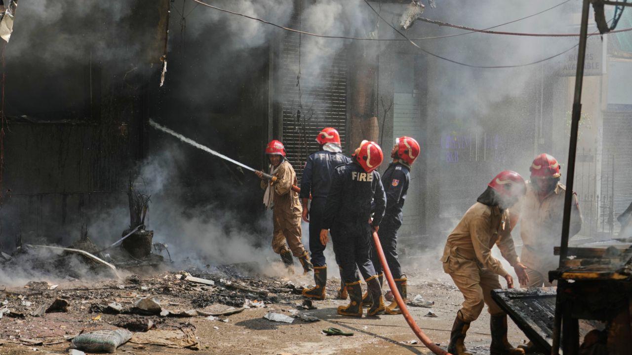 Firefighters douse a fire in a hotel in New Delhi, India (Pic/AP)