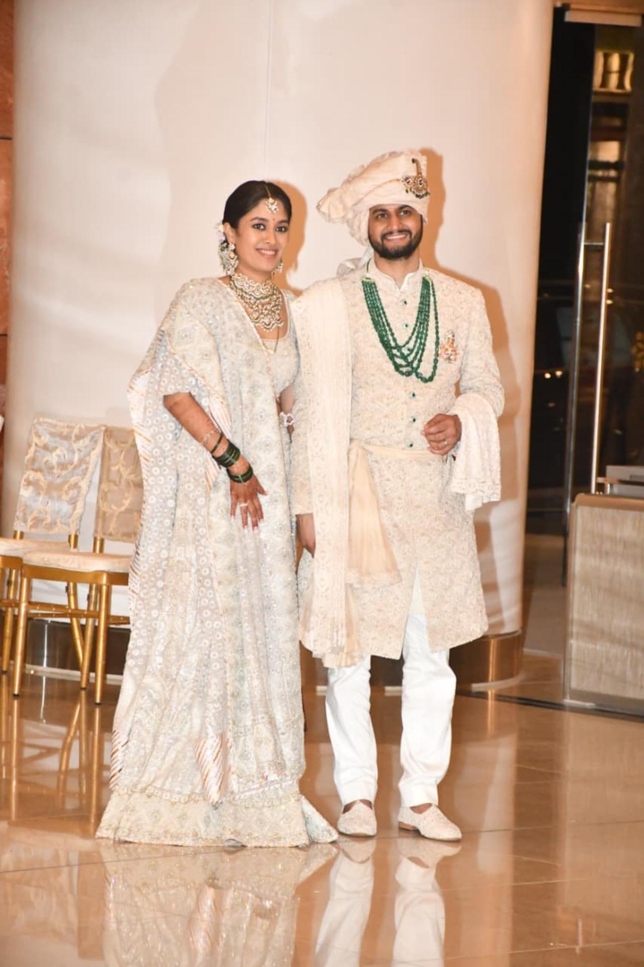 The bride and groom arrive in stunning ivory ensembles&nbsp;