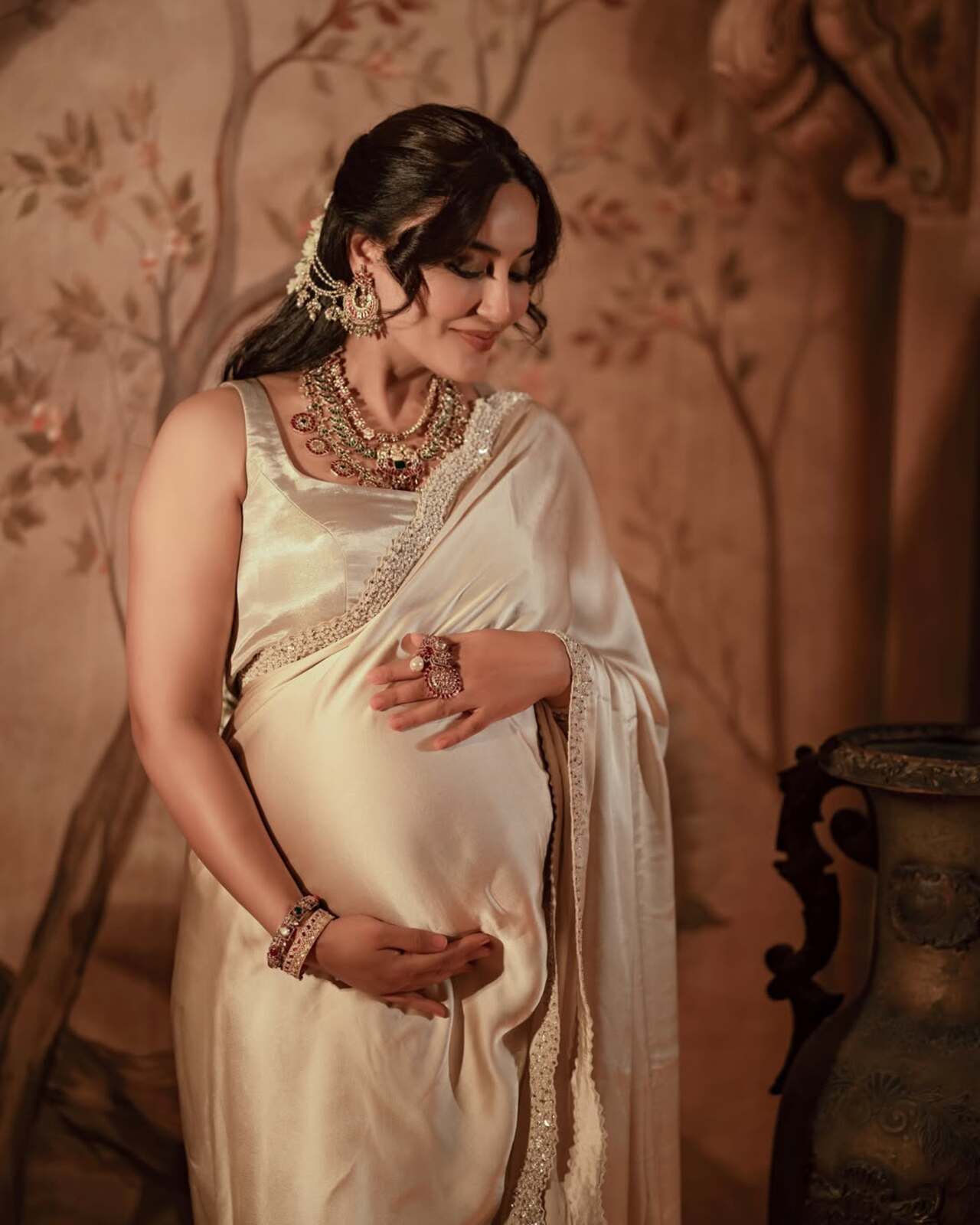 In her golden era, as Surbhi charms in a silk ivory saree for the maternity shoot