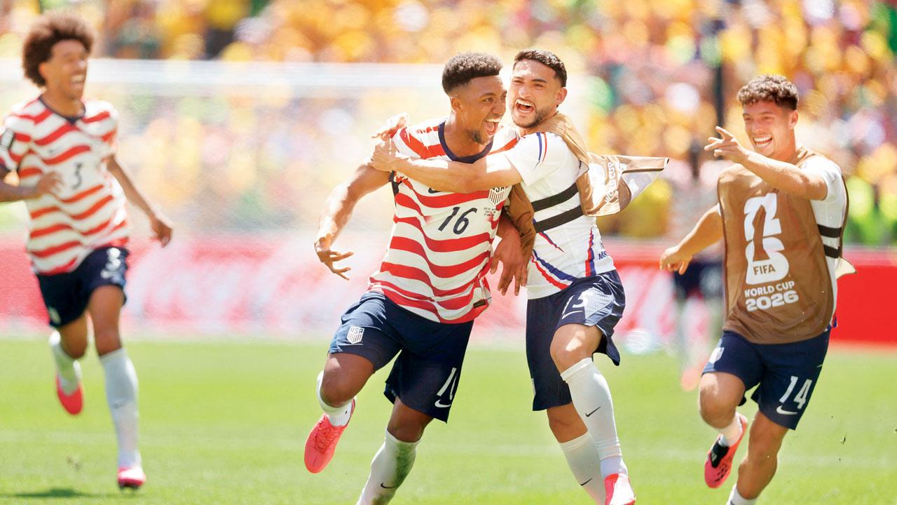 FIFA World Cup 2026: Alex Freeman helps USA advance to round of 32 with win over Australia Alex Freeman (left) celebrates scoring vs Australia on Friday. Pic/AFP