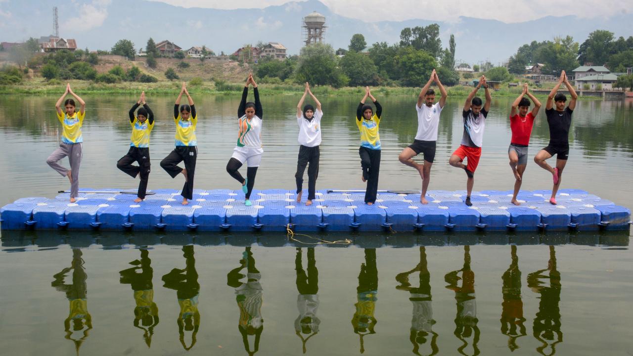 People participate in a floating yoga session on Pokhribal Lake ahead of International Yoga Day, in Srinagar People participate in a floating yoga session on Pokhribal Lake ahead of International Yoga Day, in Srinagar