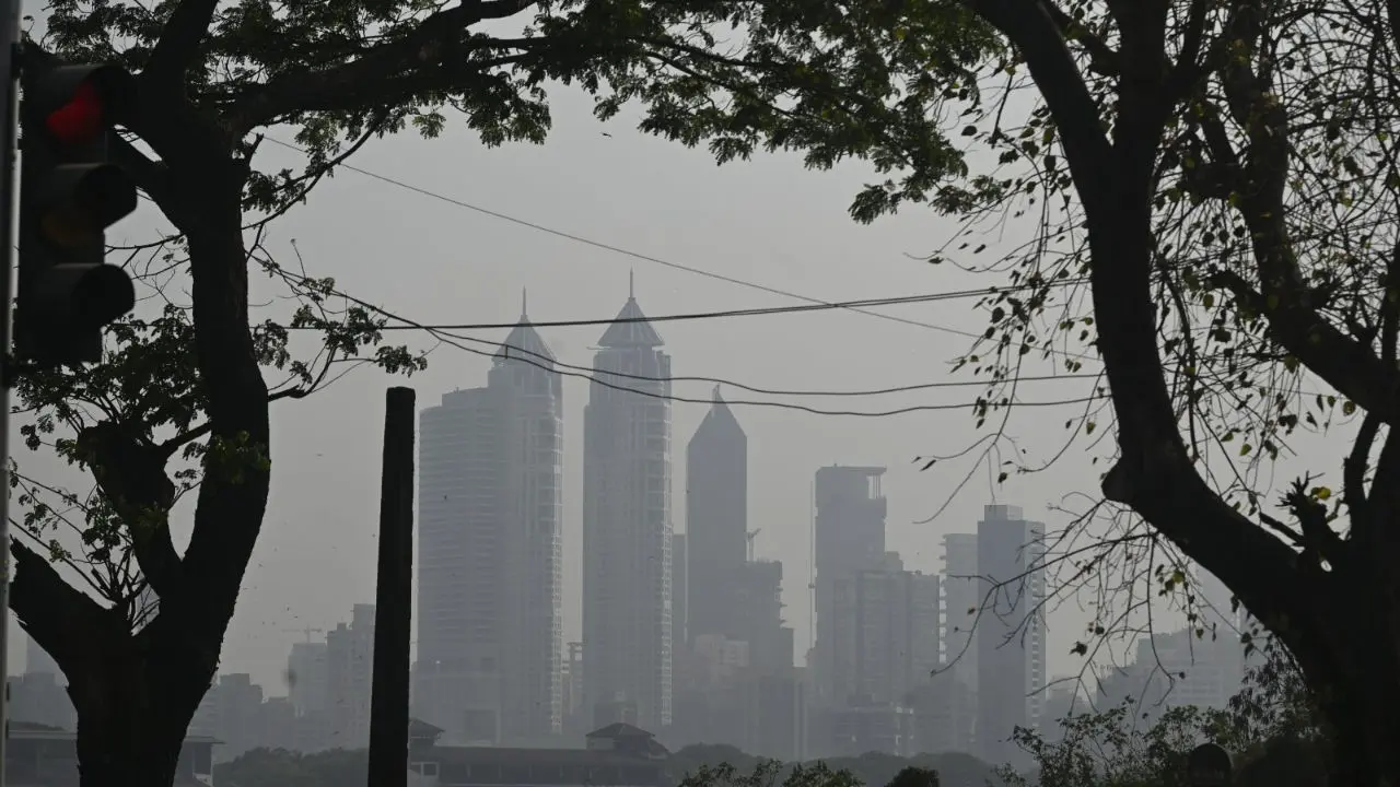 Mumbai's iconic skyline disappears behind a curtain of smog on Friday afternoon