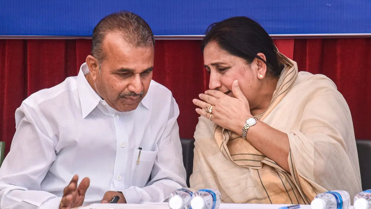 DyCm Sunetra Pawar (R) and former state minister Balasaheb Patil (L) interacting during the visit to the samadhi 