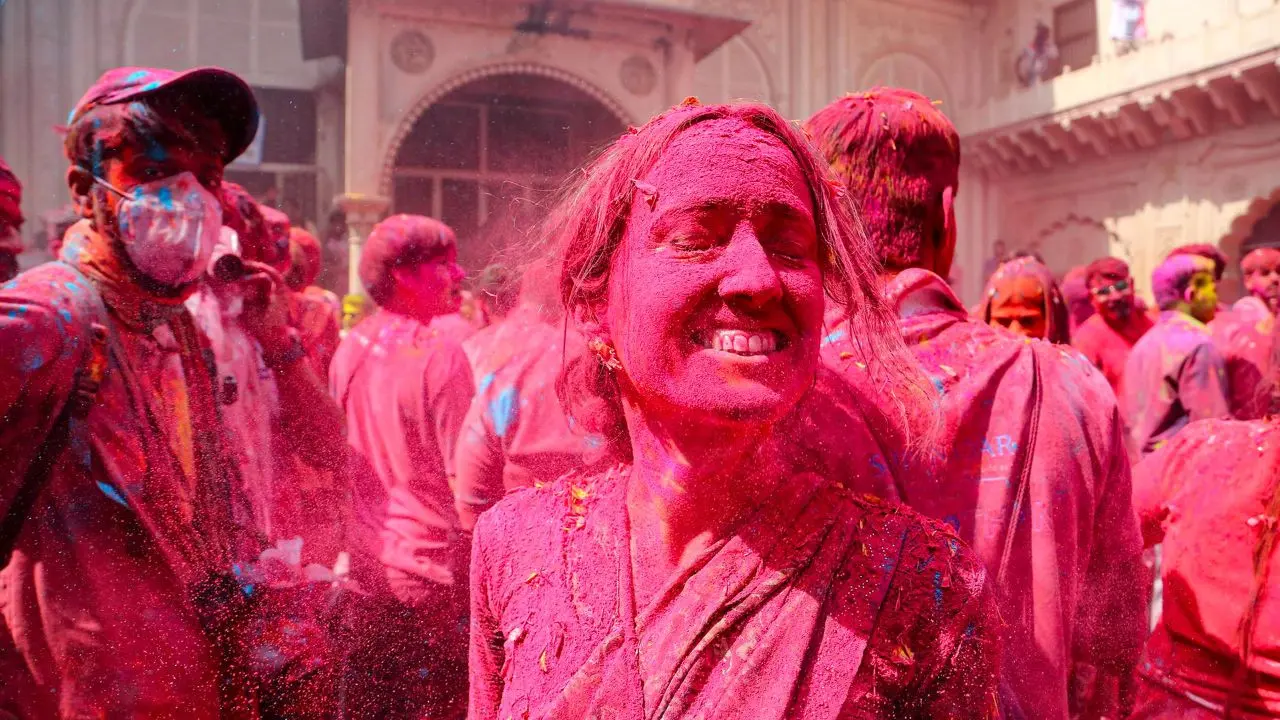 A widow smeared in 'gulal' during celebrations ahead of the 'Holi' festival. Pic/PTI