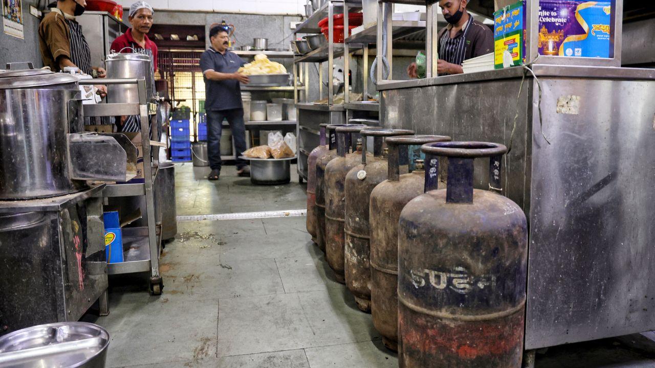 With domestic LPG prioritized, households continue to get gas while hotels struggle. A restaurant in Bengaluru is seen storing cylinders inside to manage the shortage and keep operations running