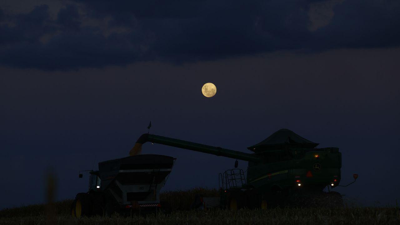 The bright moon glows over corn fields in Coxilha, Rio Grande do Sul, blending nature’s calm with cosmic beauty