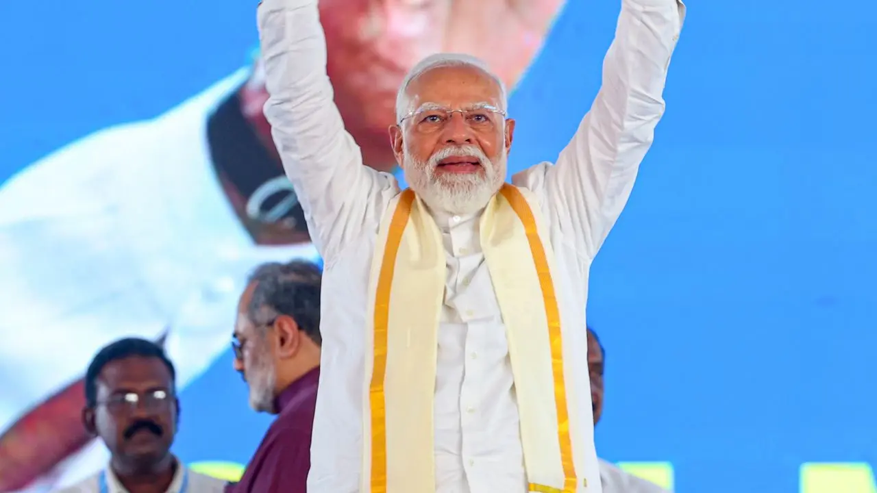 PM Modi took part in the 300-metre-long road show which was organized at the Jawaharlal Nehru International Stadium in Kochi