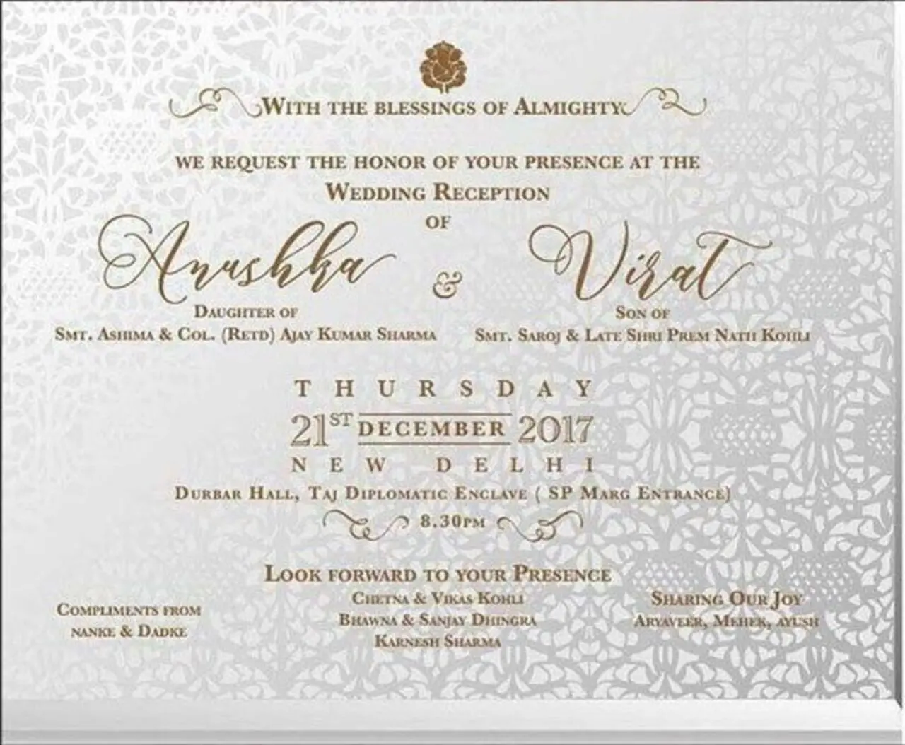 Anushka and Virat Kohli's wedding card was a traditional one in white with gold text.