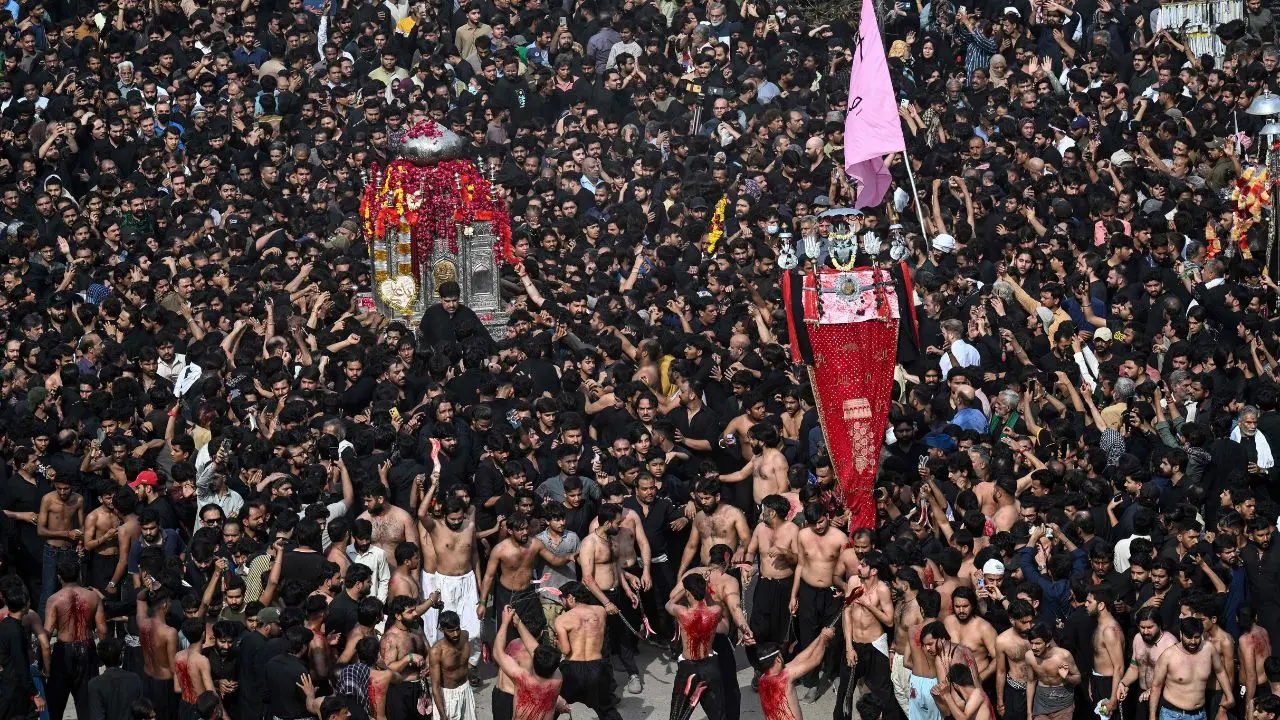 Shia Muslims march in a solemn procession in Lahore to mark the death anniversary of Imam Ali, the son-in-law of Prophet Muhammad, during the holy month of Ramadan