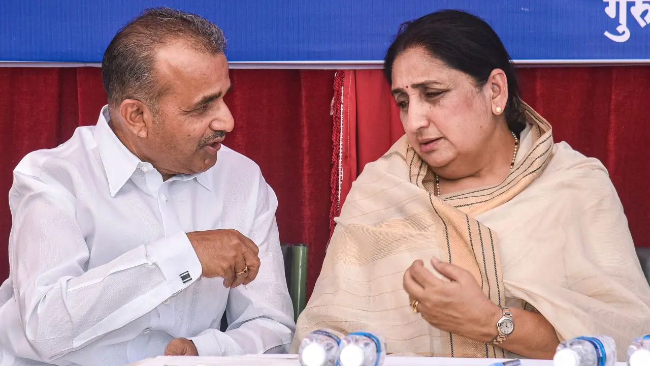 Maharashtra Deputy Chief Minister Sunetra Pawar, right, interacts with former state minister Balasaheb Patil during a visit to the samadhi of Maharashtra's first Chief Minister Yashwantrao Chavan on his 113th birth anniversary, in Karad