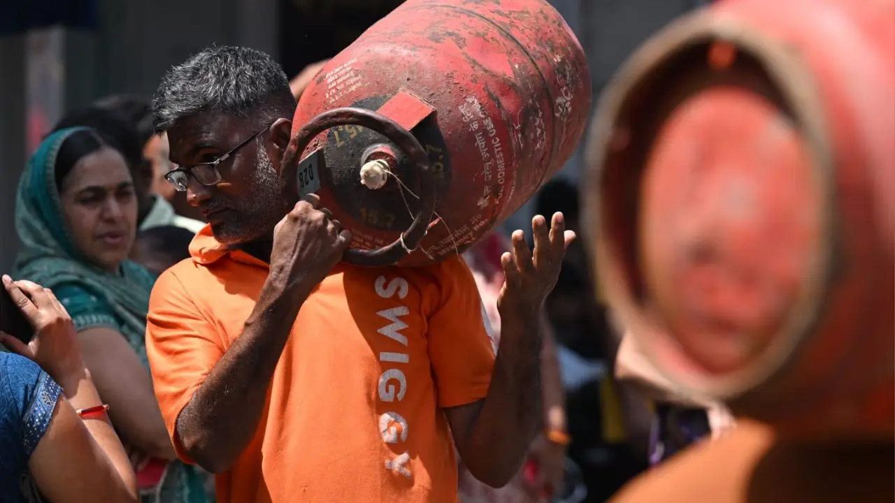 Residents of Kandivali East wait in a long queue for six to seven hours on Gaondevi Road at Poisar to collect LPG cylinders as Mumbai's cooking gas crisis shows no signs of easing
