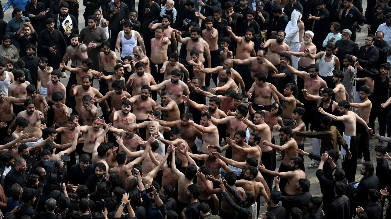 Shia Muslims mourn during a procession marking the death anniversary of Imam Ali, son-in-law of Prophet Muhammad, during the holy fasting month of Ramadan in Lahore