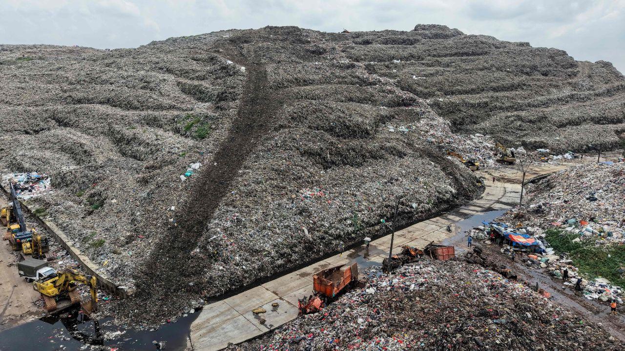Aerial shots show the sprawling 110-hectare Bantargebang facility, which receives 6,500–7,000 tonnes of waste daily from across Jakarta