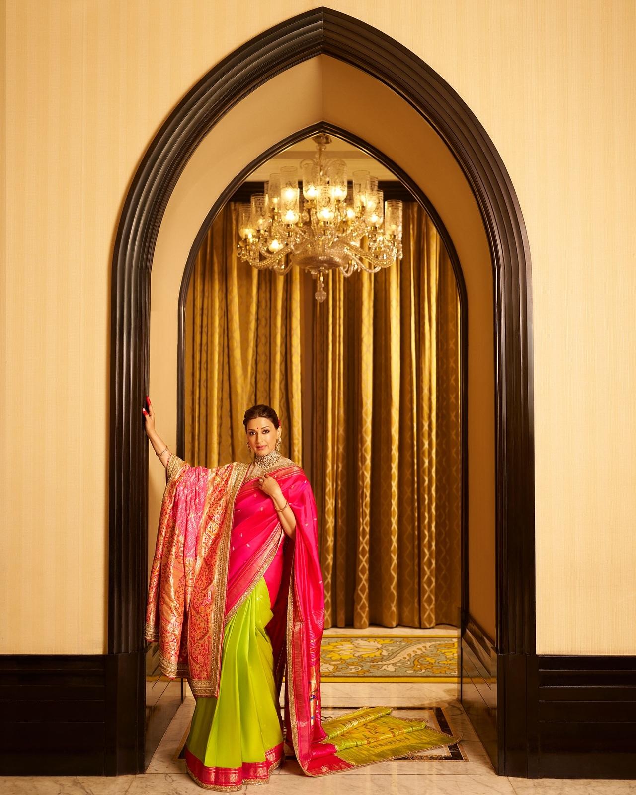 Sonali bendre looks breathtaking in this Manish malhotra's heritage Paithani saree with a zari embroidered double Palma in pink and green, paired with a Bandhej drape.